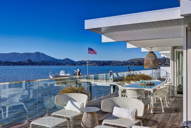 27 W Shore Rd, Belvedere, CA 94920 - balcony with a water and mountain view, a dock, and outdoor dining space