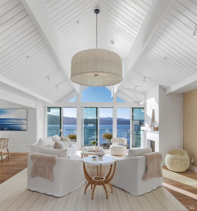 27 W Shore Rd, Belvedere, CA 94920 - living room featuring wood finished floors, a water view, a fireplace, and baseboards