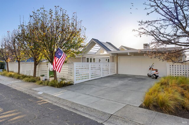 27 W Shore Rd, Belvedere, CA 94920 - ranch-style home with an attached garage and driveway