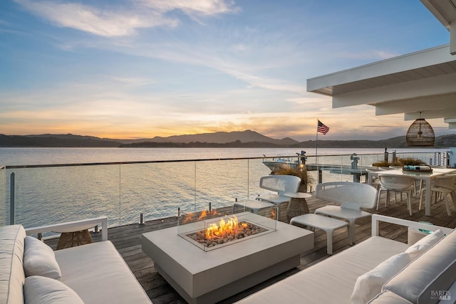 27 W Shore Rd, Belvedere, CA 94920 - deck featuring a dock, a water and mountain view, an outdoor living space with a fire pit, and boat lift