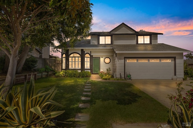 624 N Regatta Dr, Vallejo, CA 94591 - traditional-style house featuring fence, an attached garage, driveway, a front yard, and a shingled roof