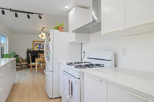 624 N Regatta Dr, Vallejo, CA 94591 - kitchen featuring wall chimney exhaust hood, white appliances, white cabinetry, light countertops, and recessed lighting