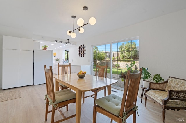 624 N Regatta Dr, Vallejo, CA 94591 - dining area featuring rail lighting and light wood-style floors
