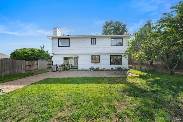 624 N Regatta Dr, Vallejo, CA 94591 - rear view of house with a patio, a chimney, and a fenced backyard