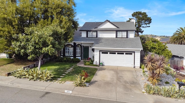 624 N Regatta Dr, Vallejo, CA 94591 - traditional-style house featuring roof with shingles, fence, concrete driveway, a garage, and a chimney