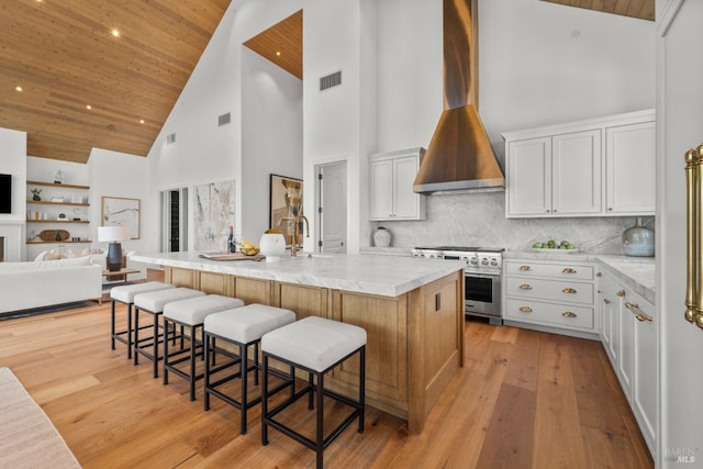 2509 Madrona Ave, Saint Helena, CA 94574 - kitchen featuring stainless steel range, high vaulted ceiling, open floor plan, visible vents, and wooden ceiling