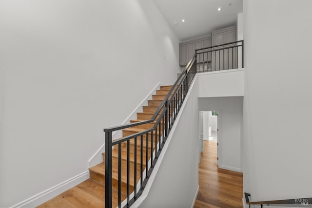 2509 Madrona Ave, Saint Helena, CA 94574 - stairs featuring wood finished floors, baseboards, a high ceiling, and recessed lighting