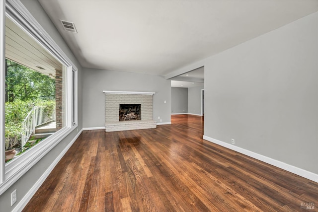 3257 State Highway 128, Calistoga, CA 94515 - unfurnished living room featuring wood finished floors, baseboards, and a brick fireplace