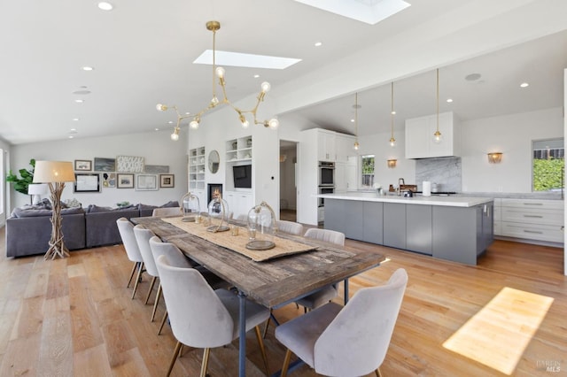 46 Lower N Ter, Tiburon, CA 94920 - kitchen featuring white cabinetry, backsplash, a fireplace, and an island with sink