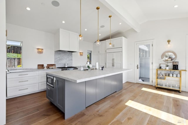 46 Lower N Ter, Tiburon, CA 94920 - kitchen with wood finished floors, built in appliances, a healthy amount of sunlight, and a sink