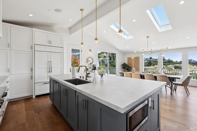 46 Lower N Ter, Tiburon, CA 94920 - kitchen with a sink, lofted ceiling with beams, stainless steel gas stovetop, backsplash, and white cabinets