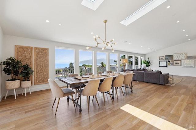 46 Lower N Ter, Tiburon, CA 94920 - dining room featuring vaulted ceiling with skylight, recessed lighting, an inviting chandelier, light wood finished floors, and baseboards