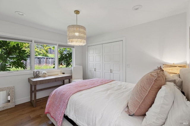 46 Lower N Ter, Tiburon, CA 94920 - bedroom featuring a closet, a chandelier, wood finished floors, and baseboards