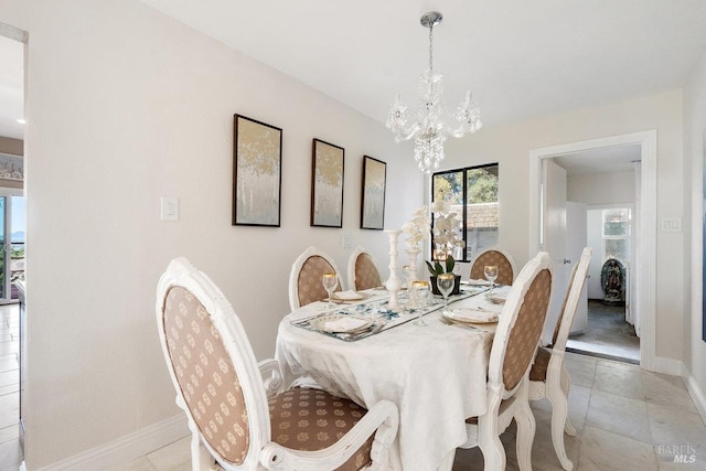 3580 Star Ridge Rd, Hayward, CA 94542 - dining space with baseboards, a notable chandelier, and light tile patterned flooring