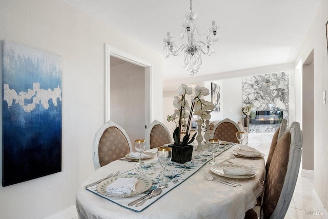 3580 Star Ridge Rd, Hayward, CA 94542 - tiled dining space with a chandelier and baseboards