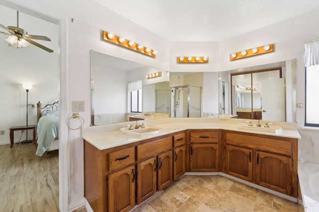 151 Doncaster Dr, Vallejo, CA 94591 - bathroom featuring double vanity, connected bathroom, a stall shower, and a sink