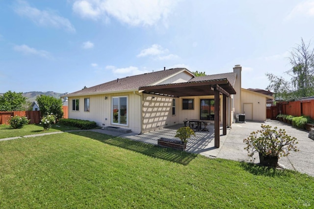 151 Doncaster Dr, Vallejo, CA 94591 - back of property featuring a patio, central AC, a chimney, a lawn, and a fenced backyard