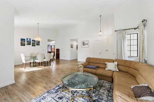 151 Doncaster Dr, Vallejo, CA 94591 - living area featuring baseboards, high vaulted ceiling, and wood finished floors