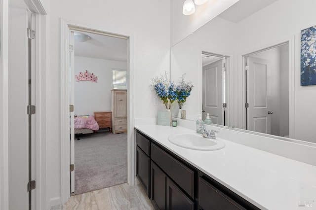 ensuite bathroom with ensuite bath and vanity