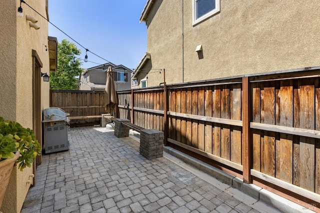 view of patio featuring a fenced backyard and grilling area