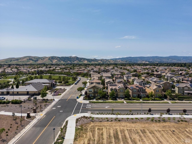 drone / aerial view featuring a mountain view and a residential view