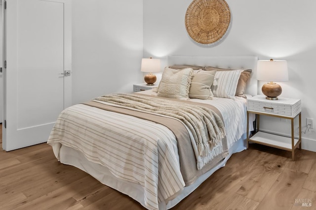 bedroom featuring wood finished floors