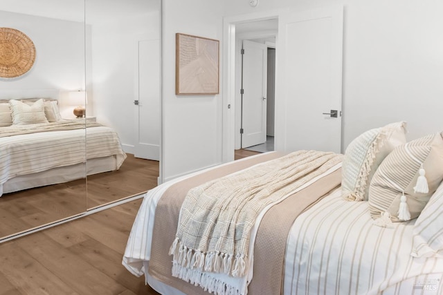 bedroom with wood finished floors