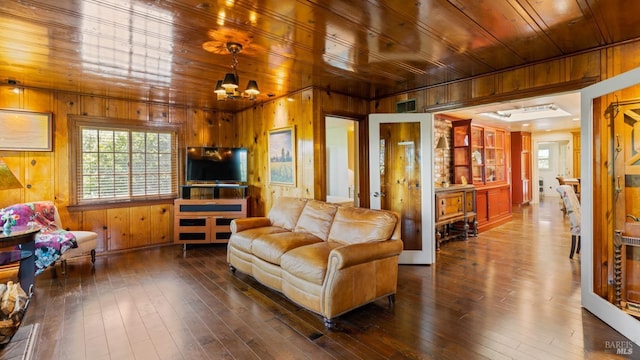 2267 Westside Rd, Healdsburg, CA 95448 - living area featuring wood walls, wooden ceiling, a chandelier, and dark wood-style floors