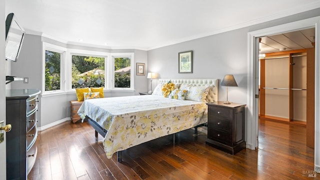 2267 Westside Rd, Healdsburg, CA 95448 - bedroom featuring baseboards, dark wood-style floors, ornamental molding, a walk in closet, and recessed lighting