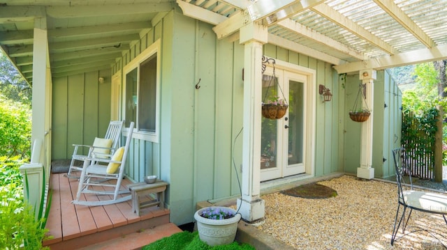 2267 Westside Rd, Healdsburg, CA 95448 - doorway to property featuring board and batten siding, a pergola, and french doors