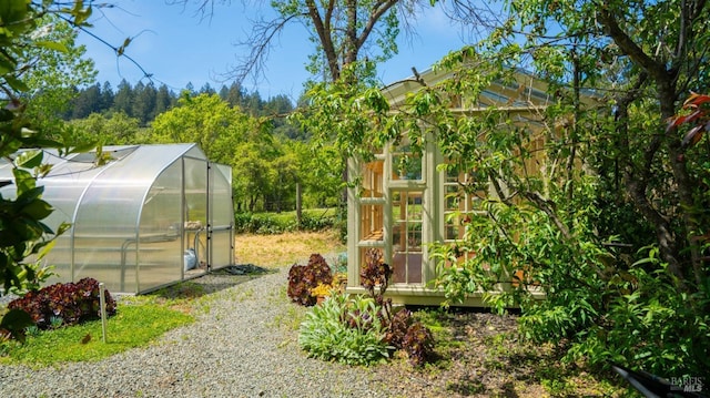 2267 Westside Rd, Healdsburg, CA 95448 - view of yard with a greenhouse and an outdoor structure