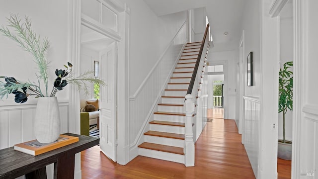 643 3rd St, Napa, CA 94559 - staircase featuring wood finished floors, a decorative wall, and wainscoting