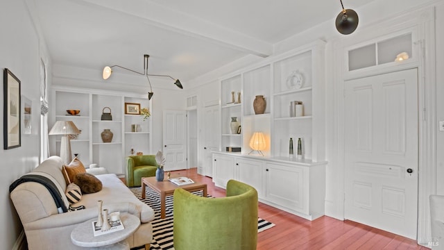 643 3rd St, Napa, CA 94559 - living area with beamed ceiling, light wood-type flooring, visible vents, and built in shelves