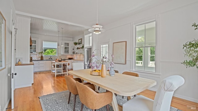 643 3rd St, Napa, CA 94559 - dining area featuring wainscoting and light wood-style floors