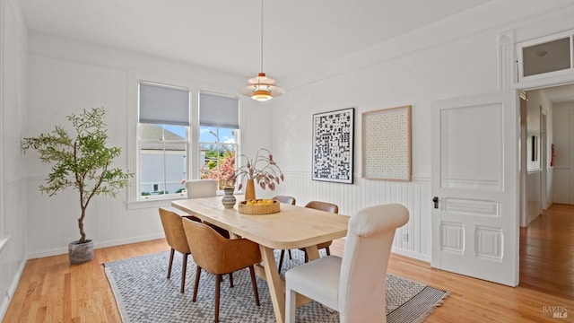 643 3rd St, Napa, CA 94559 - dining space with a wainscoted wall, light wood-style floors, and baseboards