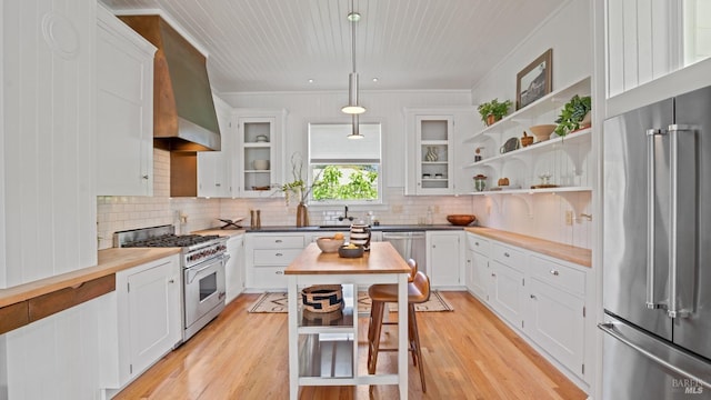 643 3rd St, Napa, CA 94559 - kitchen featuring a sink, white cabinetry, tasteful backsplash, and high end appliances