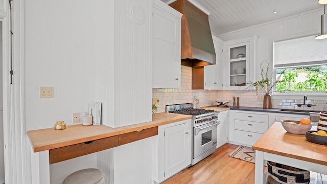 643 3rd St, Napa, CA 94559 - kitchen with a sink, premium range hood, tasteful backsplash, butcher block counters, and high end range