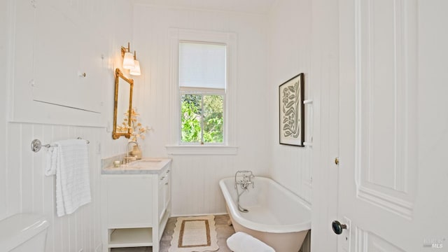 643 3rd St, Napa, CA 94559 - bathroom with a freestanding bath, a decorative wall, and vanity