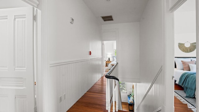 643 3rd St, Napa, CA 94559 - hall featuring wood finished floors, visible vents, and an upstairs landing