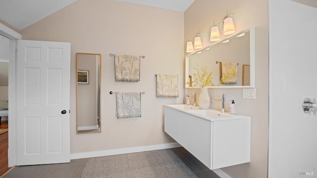 643 3rd St, Napa, CA 94559 - full bathroom featuring baseboards, lofted ceiling, double vanity, and a sink