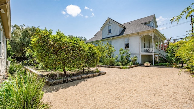643 3rd St, Napa, CA 94559 - view of side of property featuring covered porch, roof with shingles, and stairs