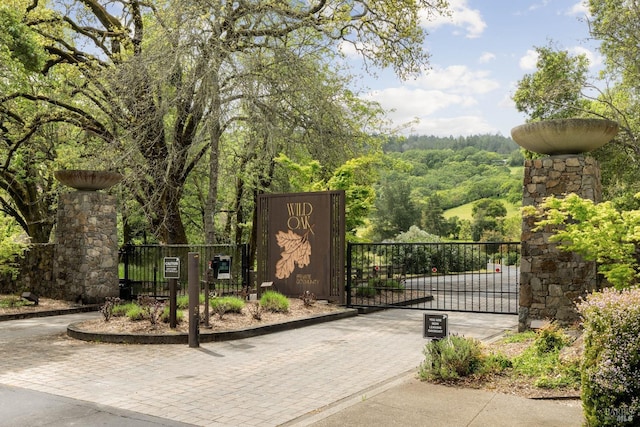 view of gate featuring fence