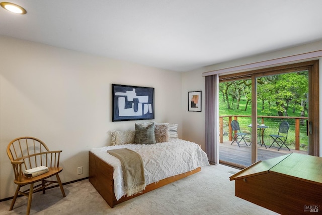 bedroom with baseboards, access to outside, and carpet