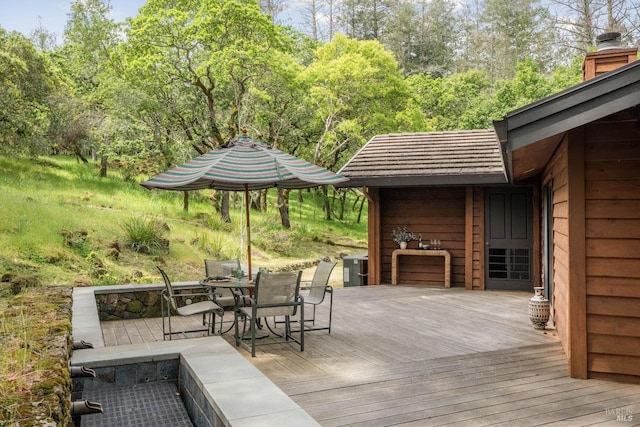 wooden deck with outdoor dining area