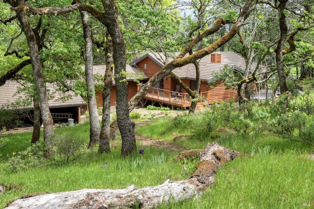 exterior space with log veneer siding