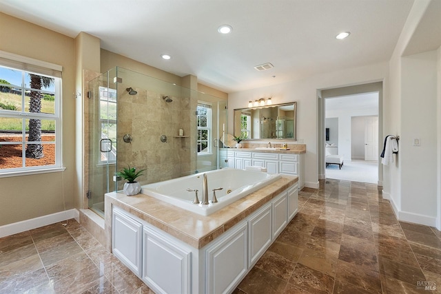 full bath featuring a stall shower, recessed lighting, baseboards, and visible vents
