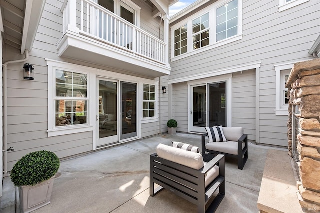 view of patio / terrace with an outdoor hangout area and a balcony