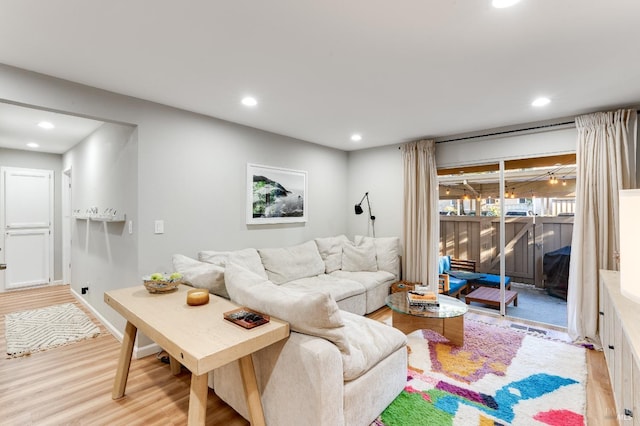 living room with wood finished floors and recessed lighting