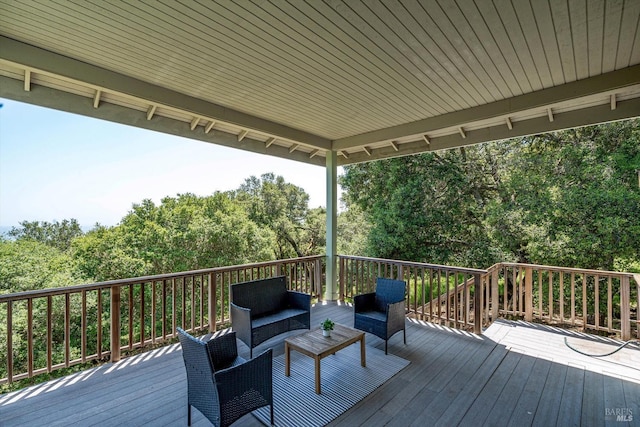 wooden terrace featuring outdoor lounge area