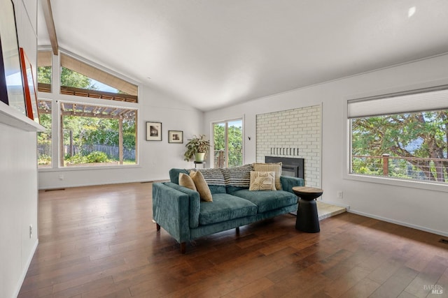 living room featuring baseboards, lofted ceiling with beams, and hardwood / wood-style flooring